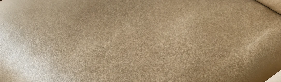 Close-up of the full-grain European water-based leather, showing the natural grain, seams and light oil finish