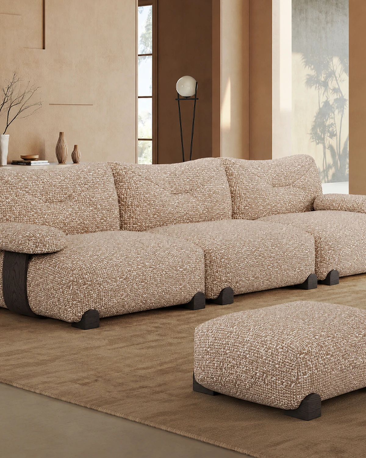 Oatmeal cotton-linen cloud sofa with ottoman in a warm minimal living room