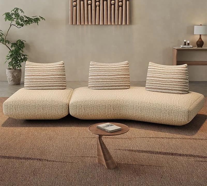 Free-form cotton-linen modular sofa in a warm minimal interior