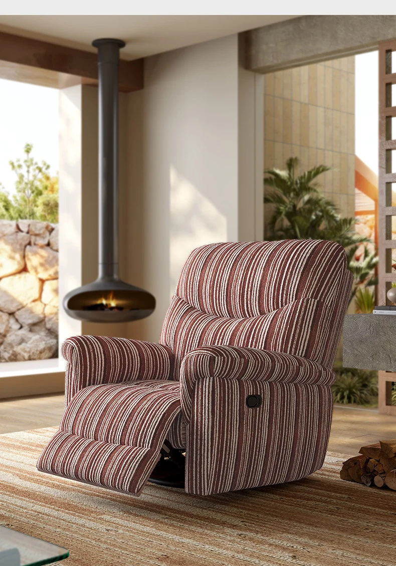 Chenille recliner armchair by a window with the footrest raised