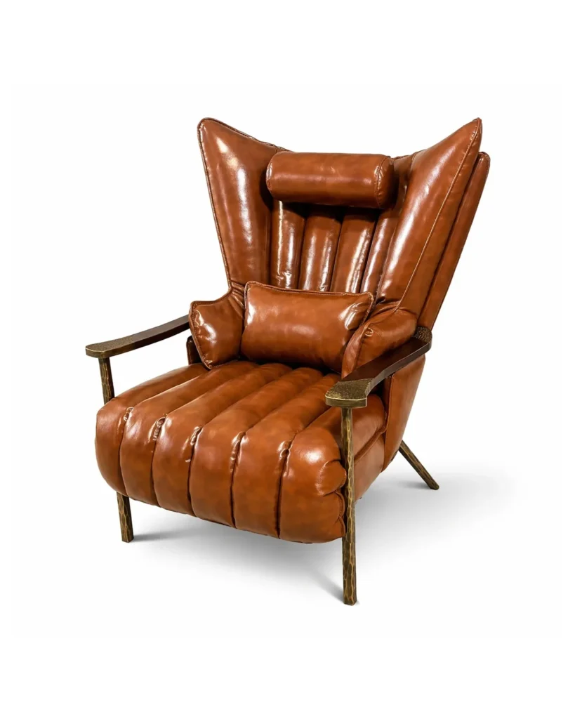 Cognac brown leather wingback accent chair with channel tufting and bronze metal frame on a white background